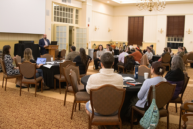 crowd gathers for discussion on the causes consequences of banning books