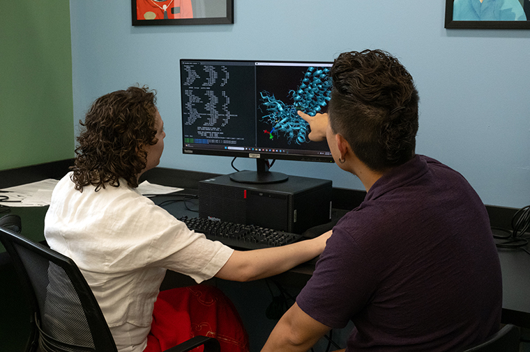 Noah Gibson '27 (right) and professor Quin Hu work on computational chemistry research