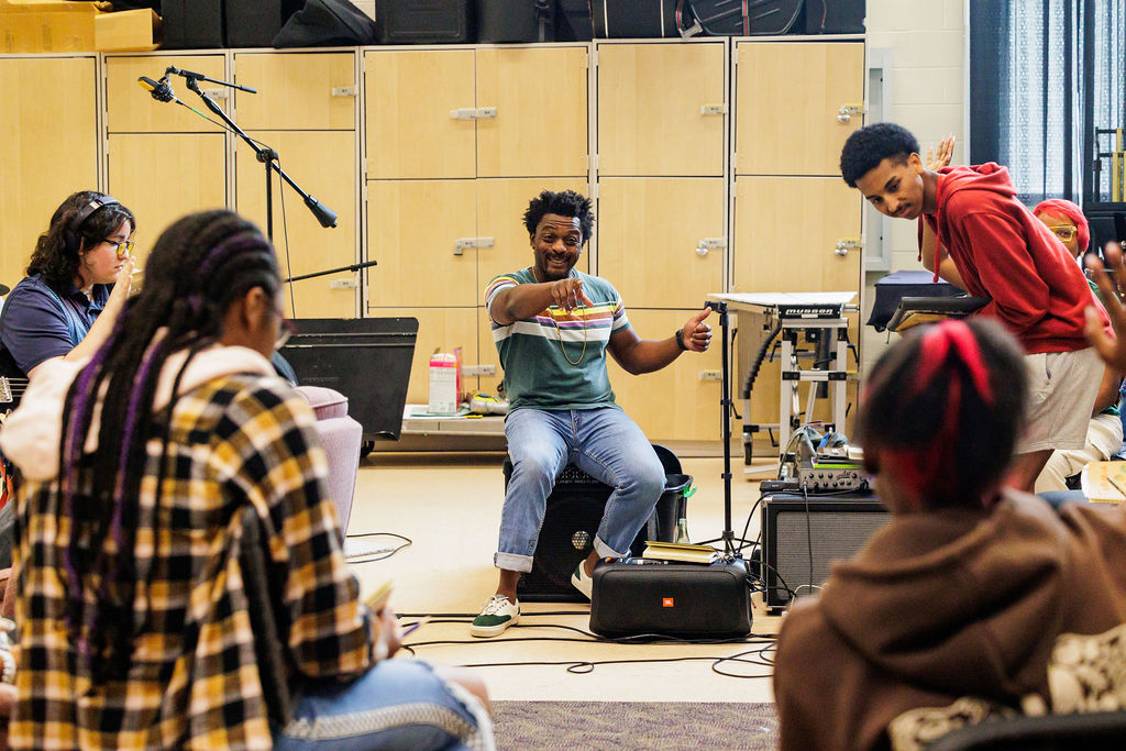 Kentavius Jones leads a music session with Hip Hop Time Capsule interns at Washington College. 