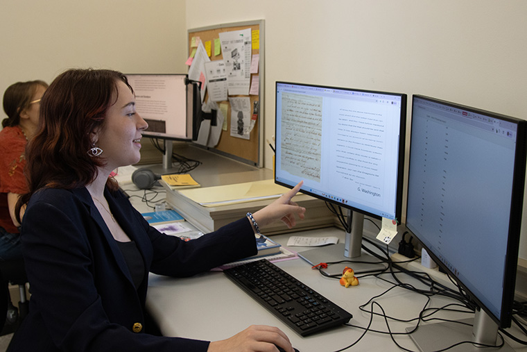 Nora Beebe '26 points to a digitized letter from George Washington in the software she uses to create or verify transcriptions for the American Philosophical Society.