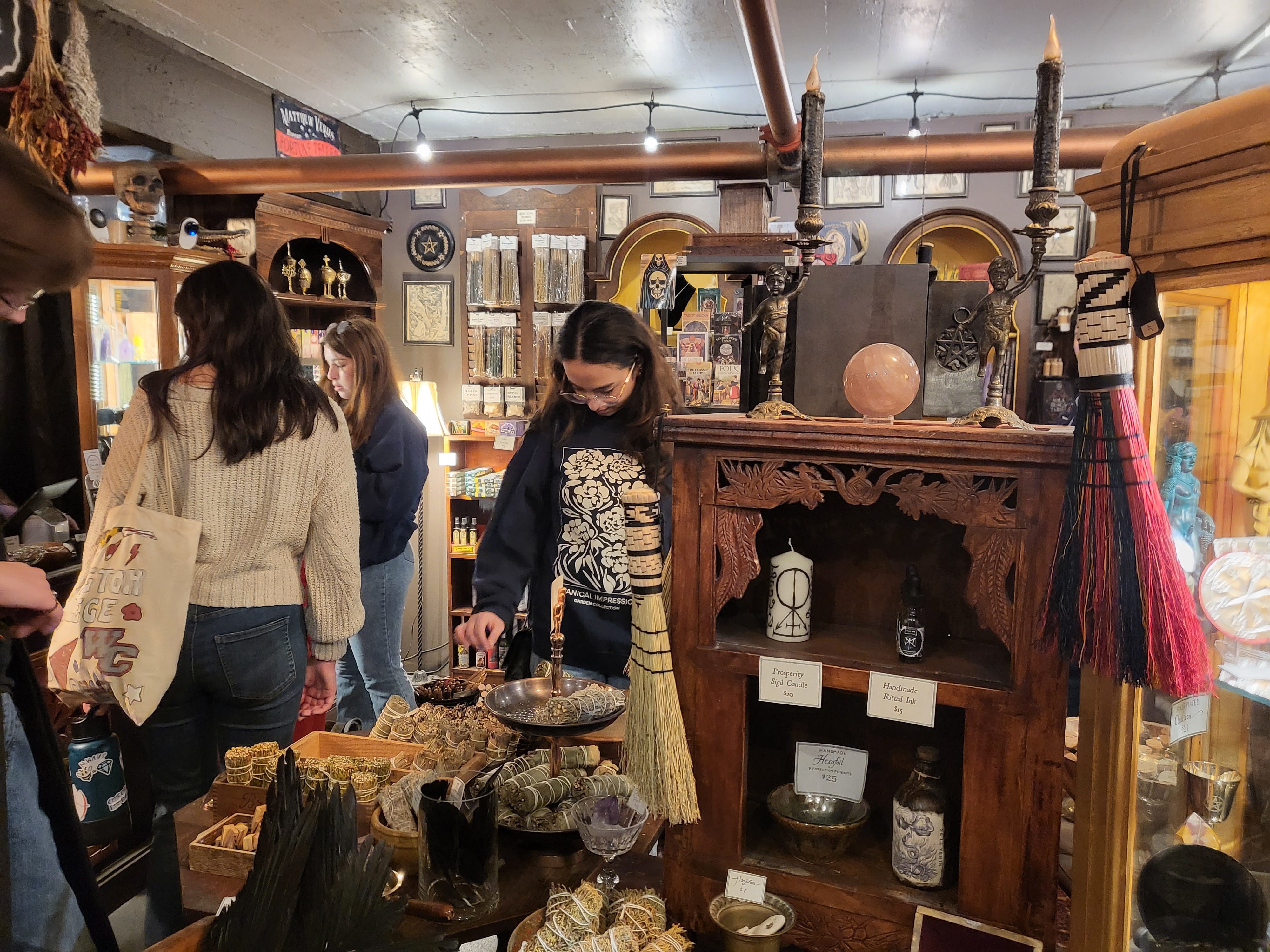Students on the spring break trip to Salem visit a withcraft shop. 