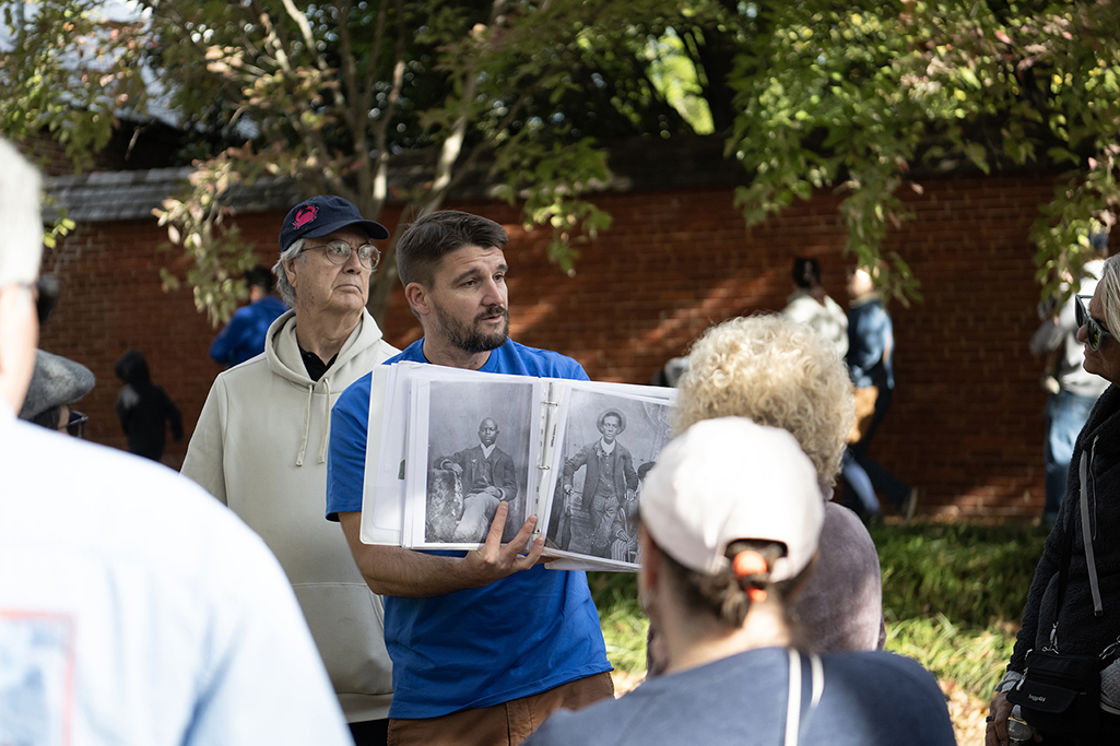 pat nugent presenting photographs to a crowd