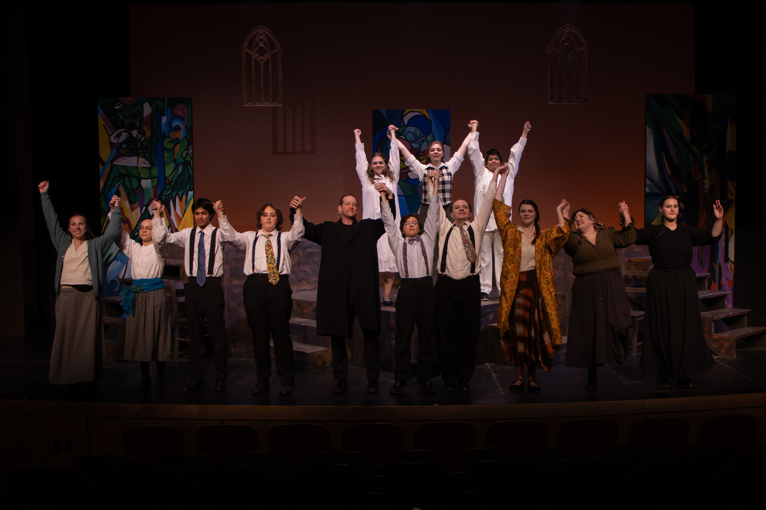 paticipants in a production of Spring Awakening taking a bow