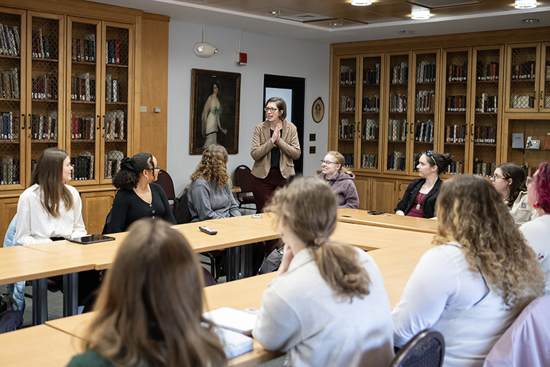 students listen to Professor Elizabeth O'Connor in the Sophie Kerr Room