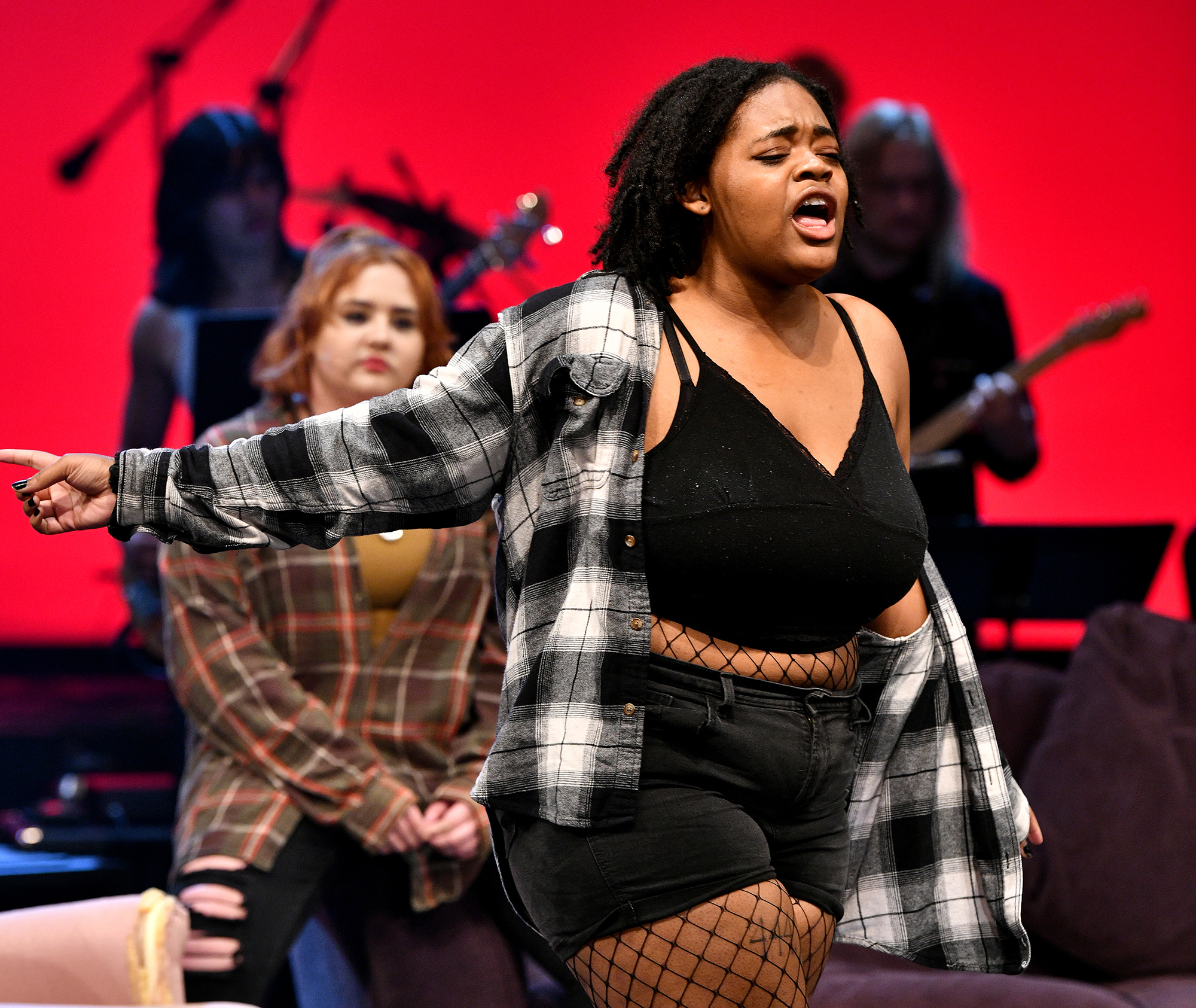 student singing in musical production