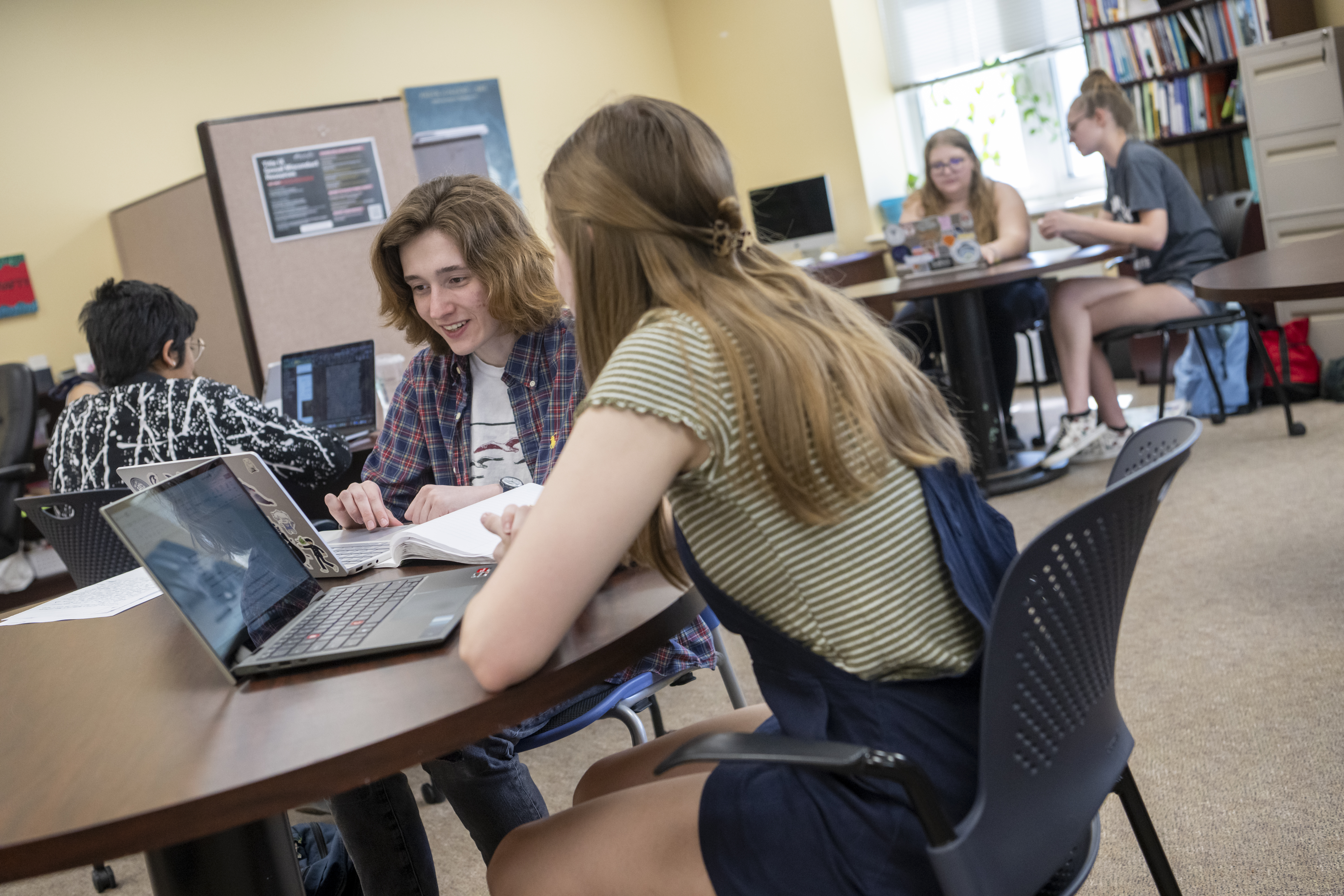 Two students sitting at a table working