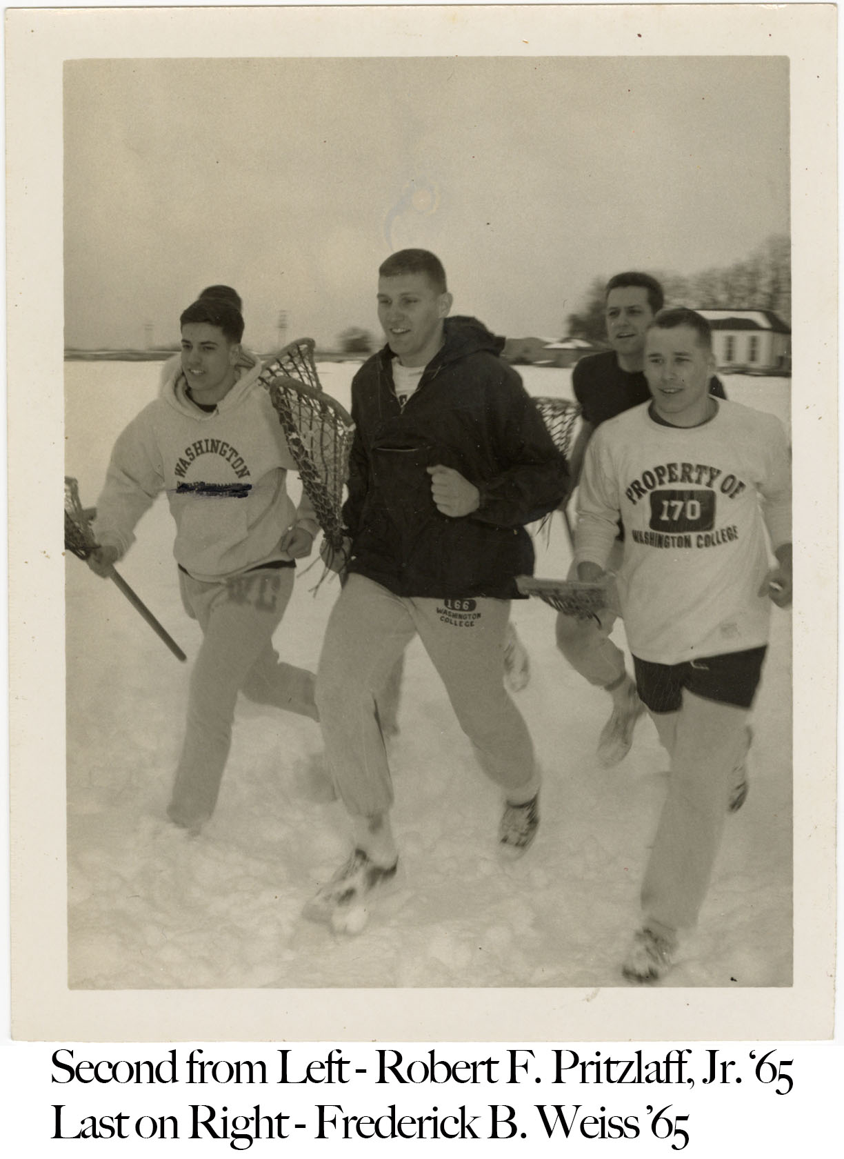 Lacrosse players running in snow